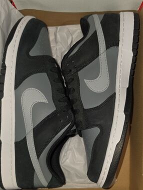 Nike Dunk Low Black Light Smoke Grey sneakers, featuring a black and grey leathe